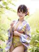 A woman in a kimono posing for a picture.