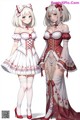 A couple of anime girls dressed in maid outfits.